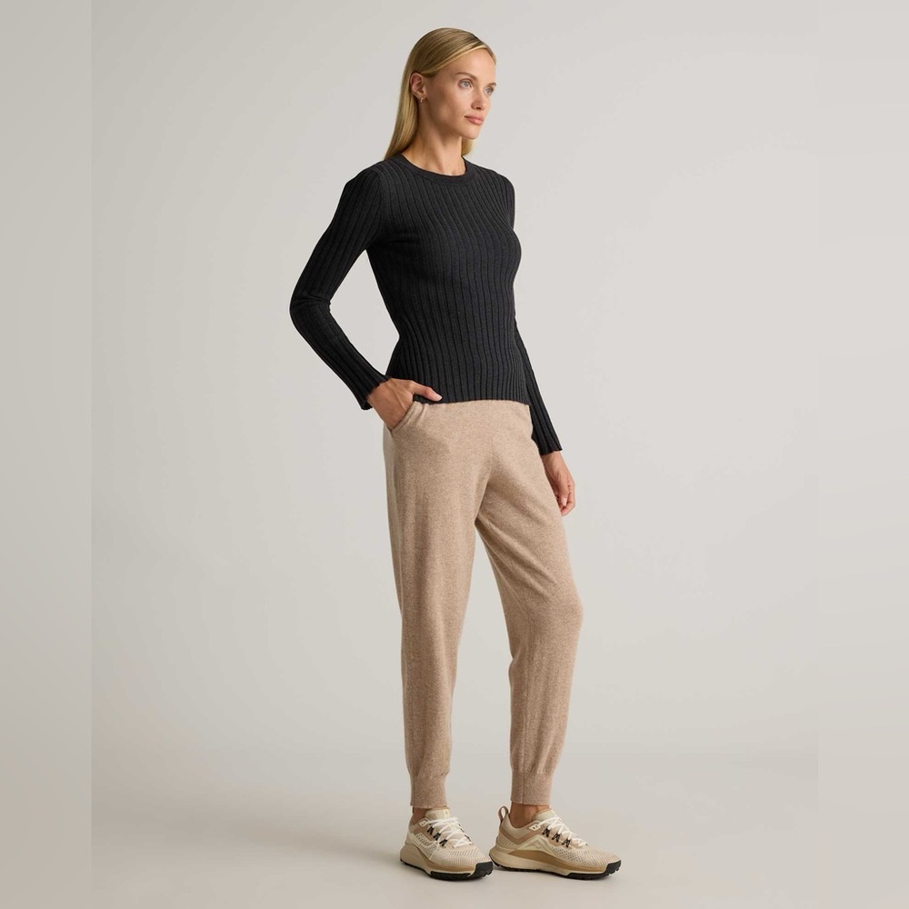 Quince Black Sweater and Tan Joggers